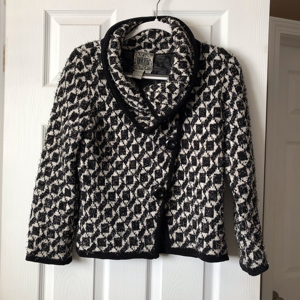 Black and white sweater jacket.